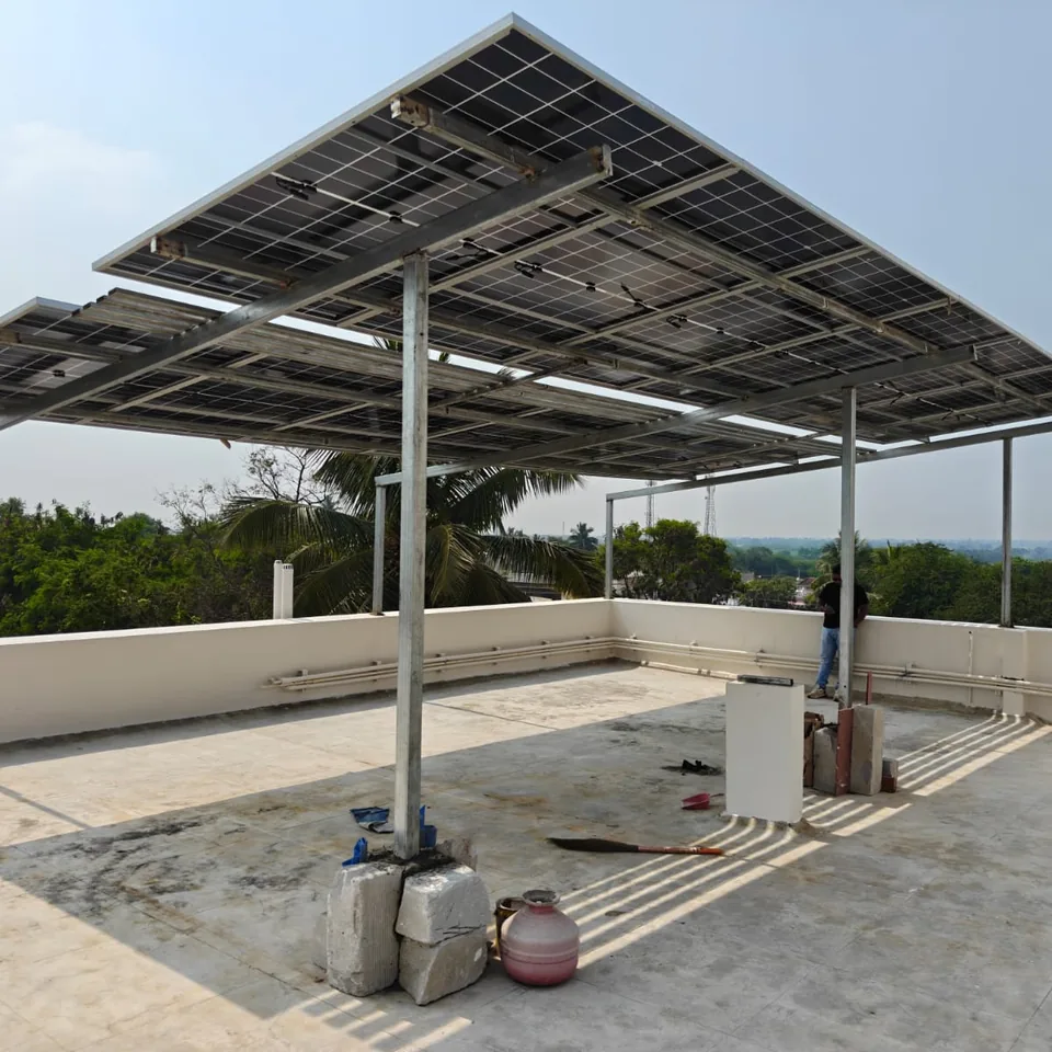 Wide view of an elevated rooftop solar structure over a terrace